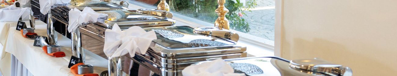 A table of closed chafing dishes