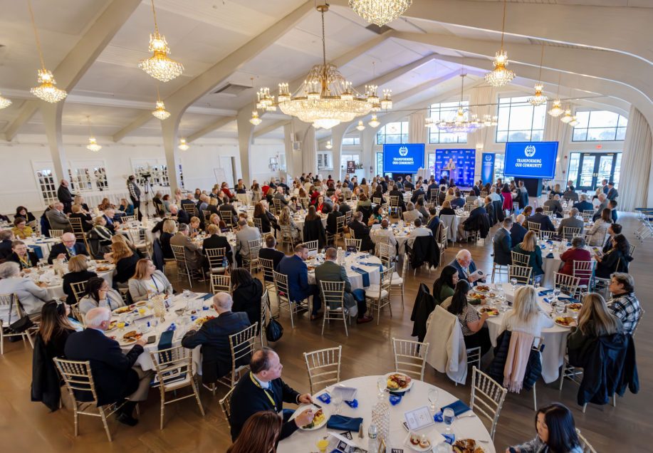 A breakfast event filled with tables of people in the Harborview Ballroom