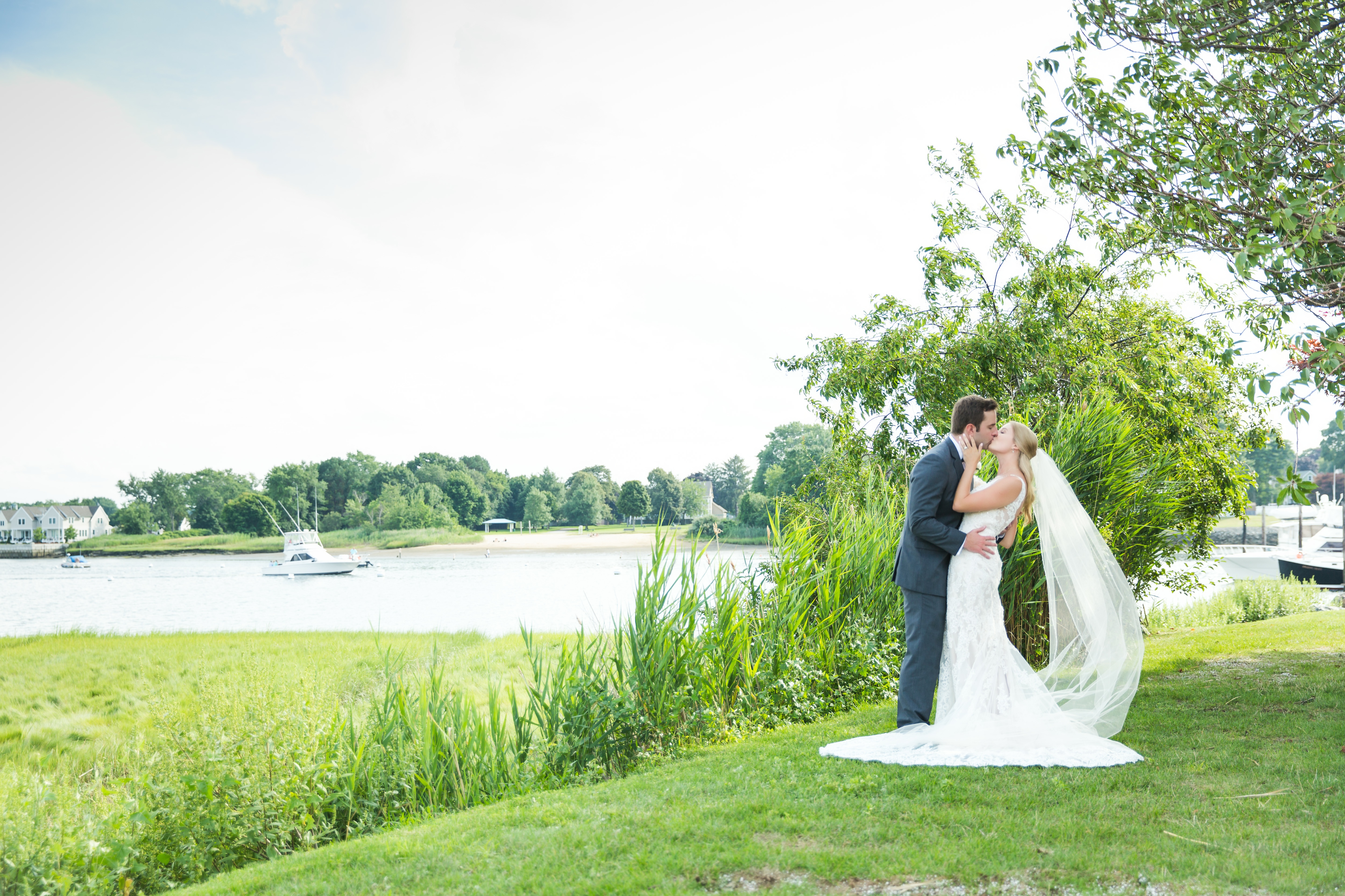 Ashley- Bridal Series Interview- Bride & Groom Kissing By Water