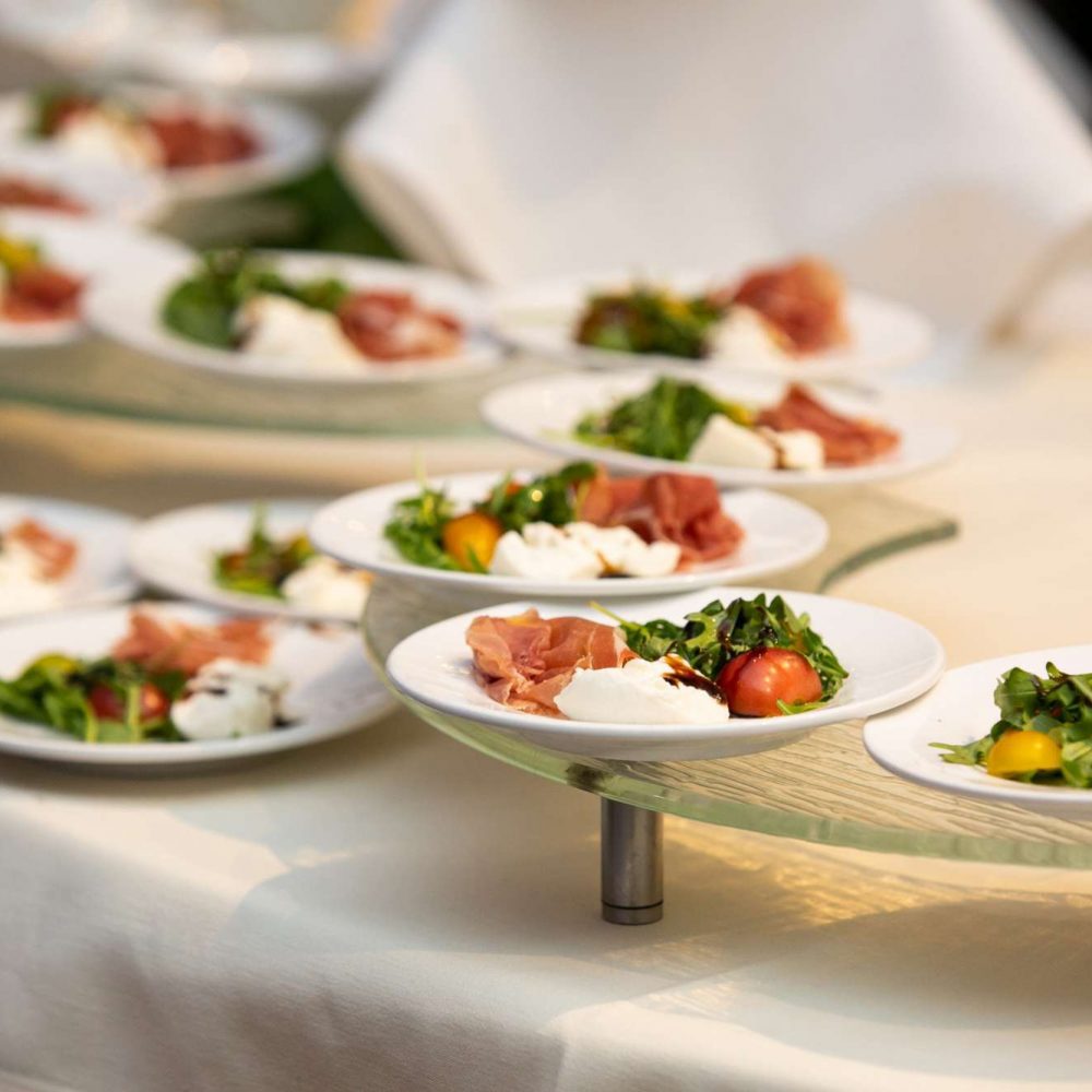 Burrata and Prosciutto baby arugula, vine ripe tomatoes, balsamic reduction