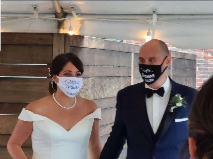 bride and groom in a mask