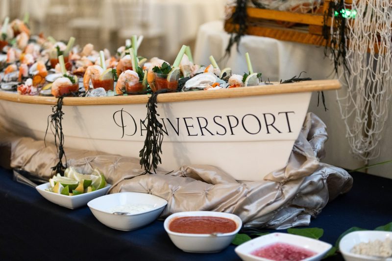 Raw bar in a small boat with Danversport's logo