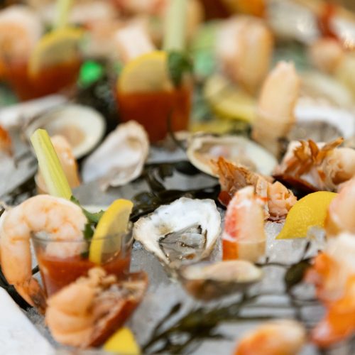 The Raw Bar with Oysters, shrimp, clams, and cocktail sauce.
