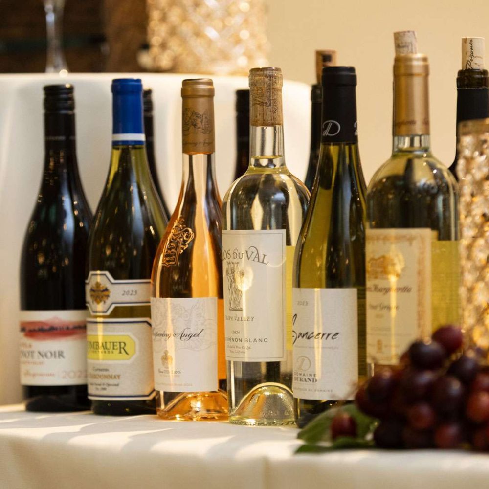 Various bottles of wine on a table.