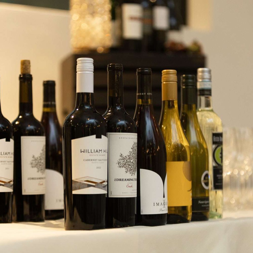 An assortment of bottles of wine on a table.