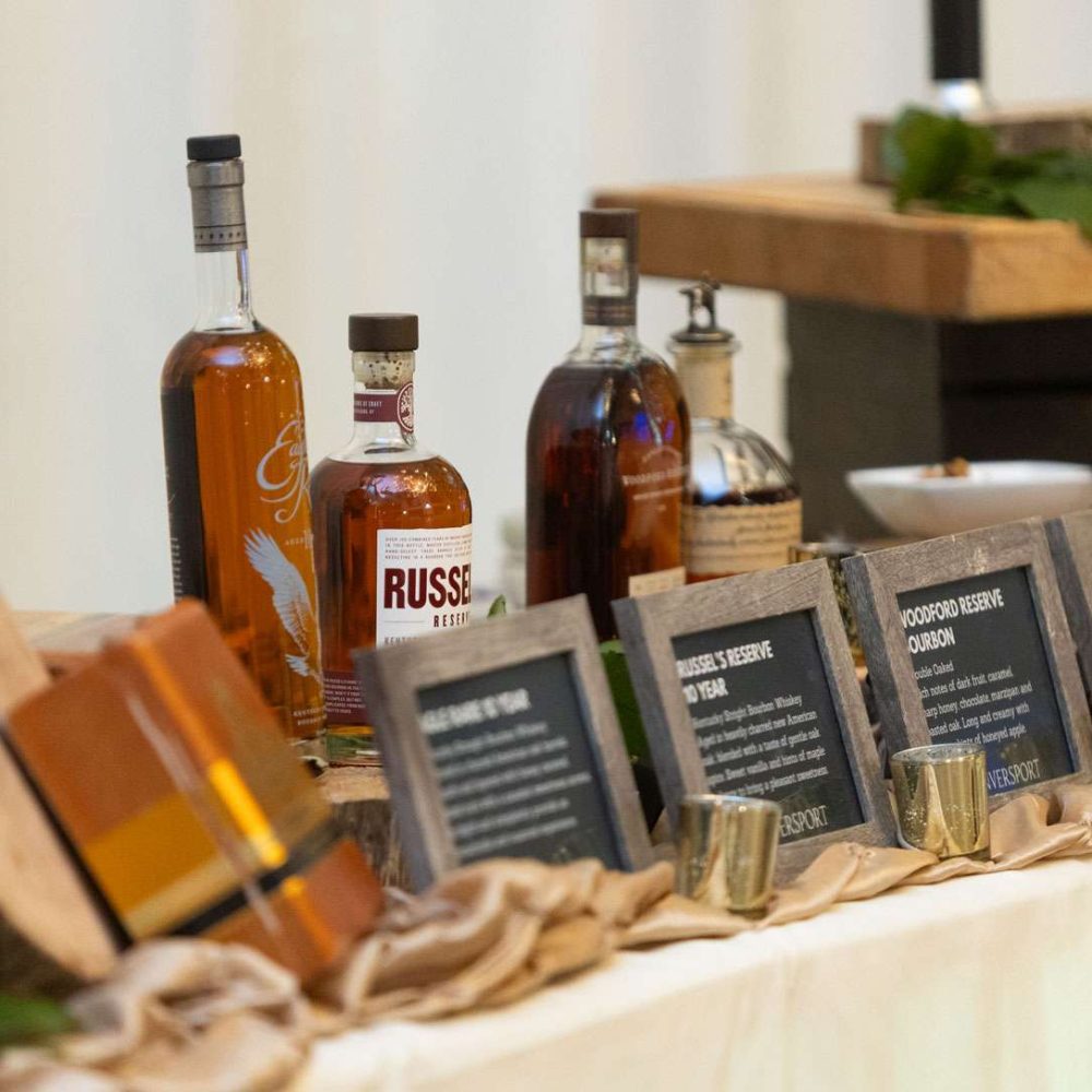 A table of various bottles of bourbon.